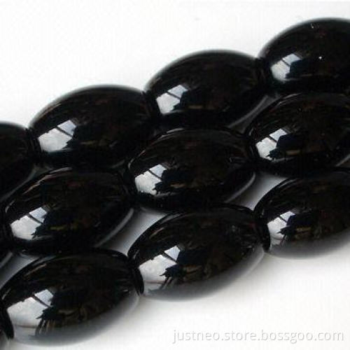 Black polished barrel-shaped semi precious agate gemstone, beaded strand